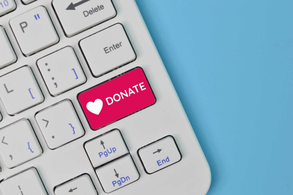 digital fundraising strategy, A laptop keyboard with a DONATE key
